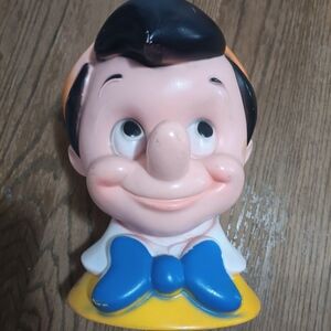 Smiling Character Bust Toy in Blue and Yellow
